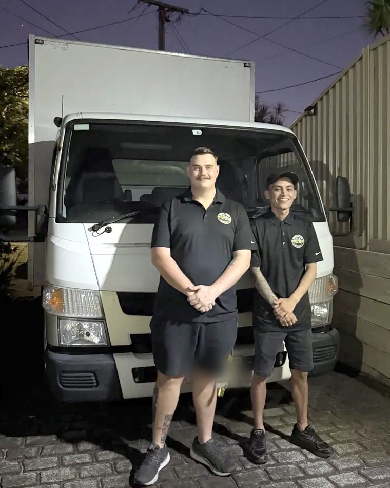 The Small & Tall Removals crew in uniform in front of their 4.5-tonne truck
